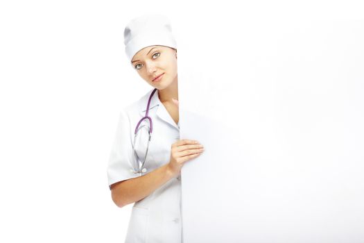 Female doctor holding the blank billboard with copy space