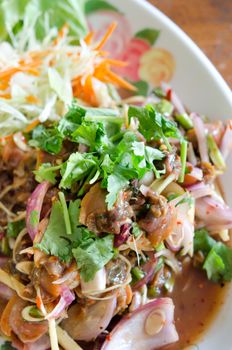 Spicy cockles salad  served with fresh vegetable on dish