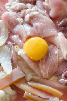 raw meat and  fresh sliced pork , yolk egg  prepare for cooking.