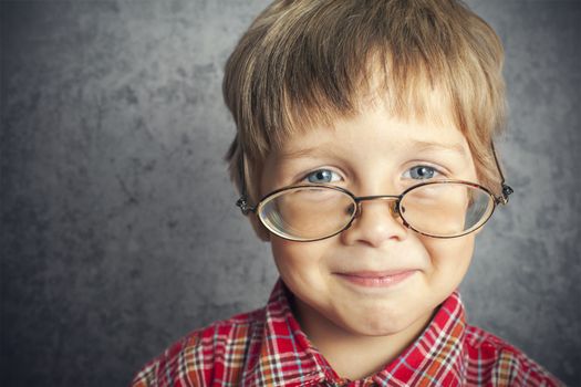 portrait of boy with glasses
