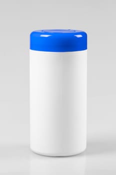 White plastic container with a blue lid on white background