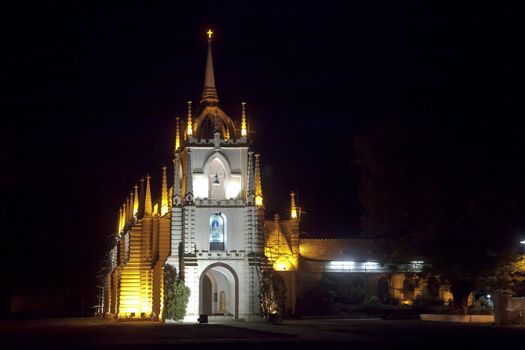 Horizontal landscape of Mae de Dues Church Goa India taken from the public road surrounding the property, generic night scene of the Portuguese inspired religious architecture