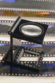 Magnifier loupe over transparency film slide for editerial department.