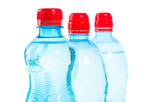 row of tops of bottles