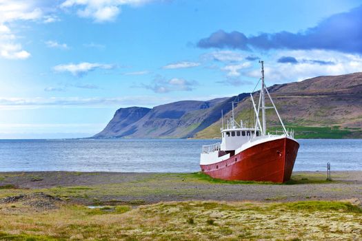 An old fishing vessel that shipwrecked on the northern coast of Iceland in the Westfjords region
