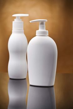 two white cosmetical sprays