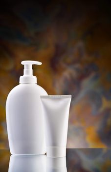 white tube and spray bottle