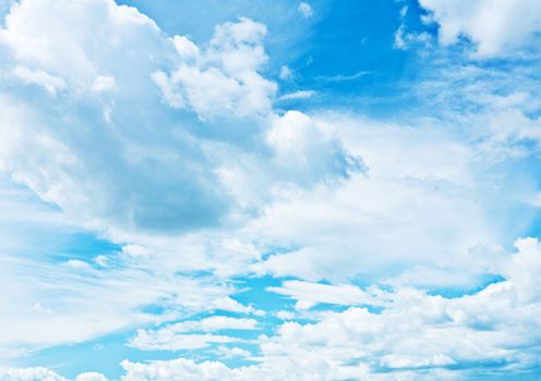 blue heaven vith sparse cumulus clouds