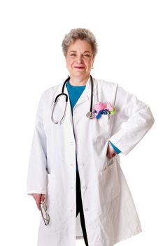 Beautiful happy smiling friendly experienced pediatrician nurse physician standing, isolated. Doctor for children with toy in pocket and stethoscope around neck.