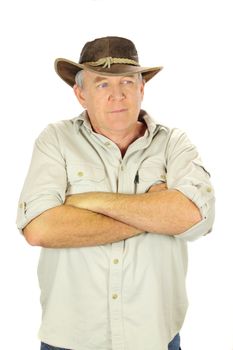 Casual middle aged man standing with arms crossed with a hat.