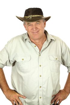 Middle aged man with in a leather hat with hands on hips.