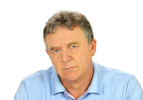 Brooding middle aged man looks directly to camera.