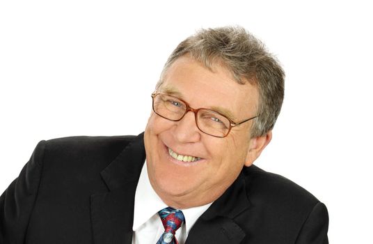 Cheerful middle aged businessman smiling looking to camera.