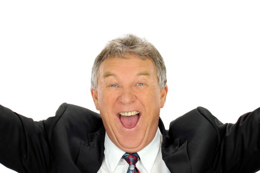 Ecstatic middle aged businessman throws his arms into the air with delight.