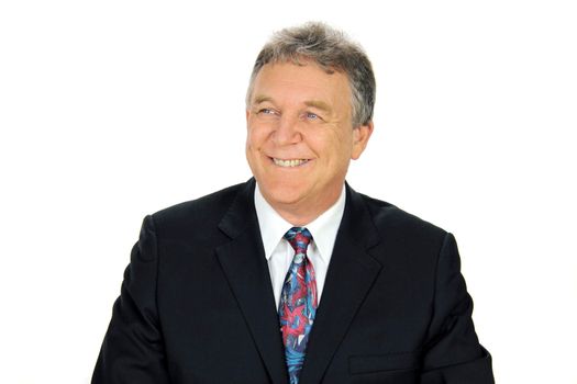 Smiling middle aged businessman looking away from camera.