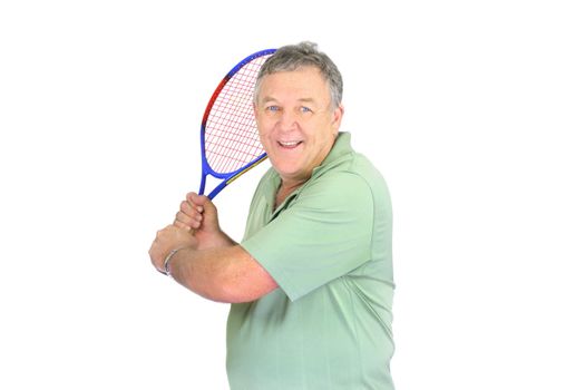 Middle aged man about to make a backhand in tennis.