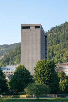 City Hall in Bergen is surrounded by green trees.