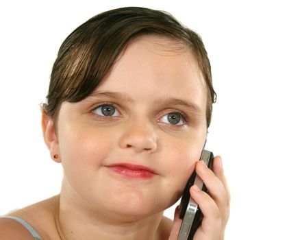 Little girl with a happy look after listening on her cell phone.