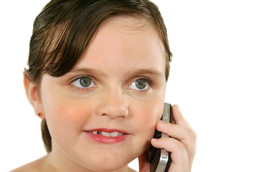 Little girl with a happy look after listening to her cell phone.