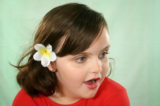 Little girl looking to camera right with a flabbergasted look.