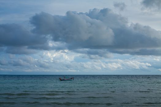 dark cloudy stormy sky with clouds and waves in the sea