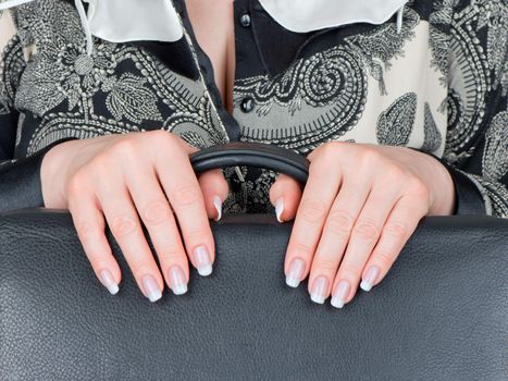 Well-groomed female hands and the varnished nails