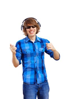 Happy smiling young man dancing and listening to music