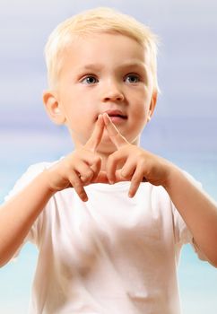 Beautiful little boy on the beach