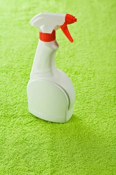 one bottle on green towel