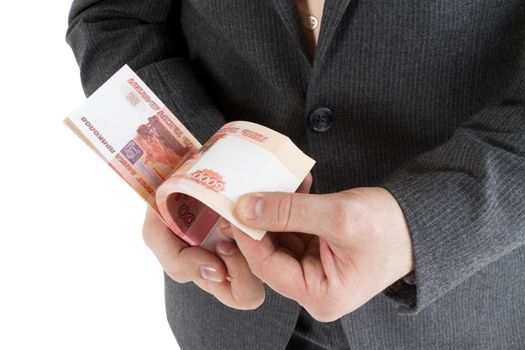 stack banknotes of 5000 rubles in male hands on a white background