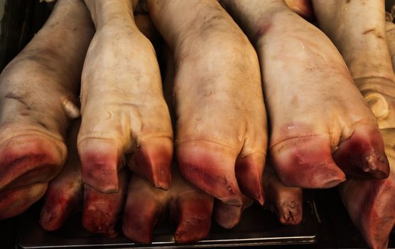 pig's trotters for sale to the market. typical Christmas food in the Italian tradition