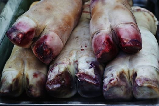 pig's trotters for sale to the market. typical Christmas food in the Italian tradition