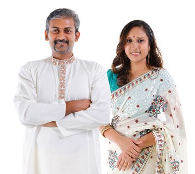 Indian couple. Portrait of mid age beautiful Indian family in traditional costume standing isolated on white background. Indian husband and wife model.