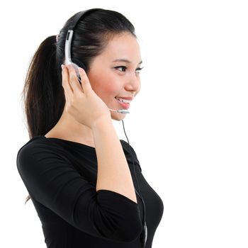 Telemarketing headset woman in black suit from call center smiling happy talking in hands free headset device. Attractive mixed race Southeast Asian / Caucasian business woman isolated on white background.