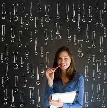 Businesswoman, student or teacher with chalk exclamation marks on blackboard background