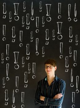 Businessman, student or teacher with chalk exclamation marks on blackboard background