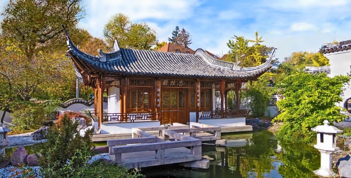 panorama scene of a typical chinese garden with temple house