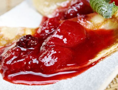 Pancakes with strawberry jam.closeup