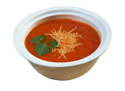 Thick and hearty tomato soup with basil.closeup