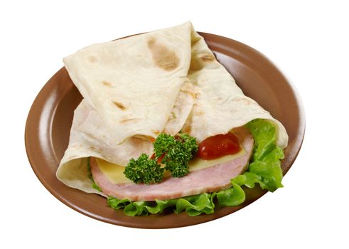 Pita Sandwich with cheese,ham,parsley,and tomato sauce.isolated
