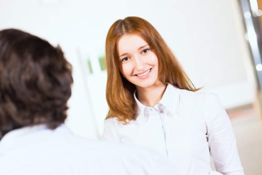 Attractive woman talking with a man, close up portrait