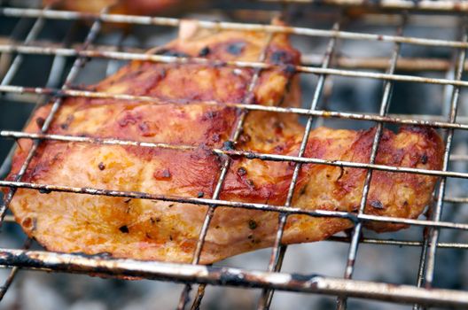 Sirloin steak prepared on the barbecue grill.  Shallow depth-of-field.