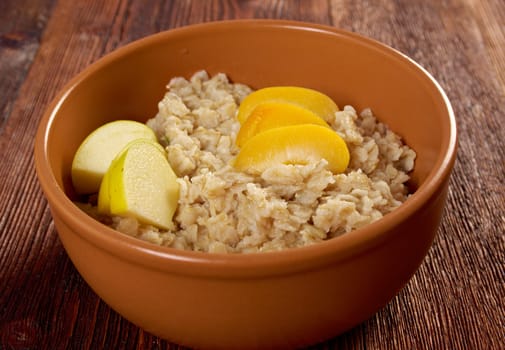 Oat porridge with  fruit, selective focus