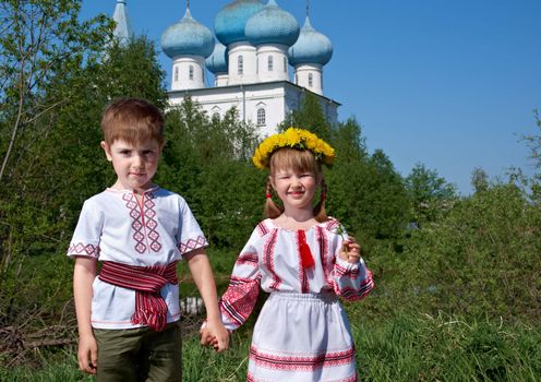  Russian Little boy and girl  on a orthodox church background