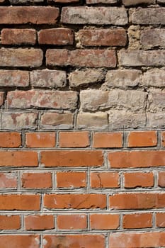 wall made in half from new bricks and other half from old bricks