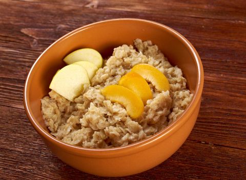 Oat porridge with  fruit, selective focus