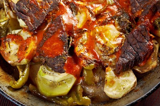  Beef Ragout with wine sauce and  vegetables on pan on french farm-style 