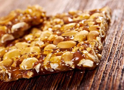 Peanut brittle sweet hard on wooden table