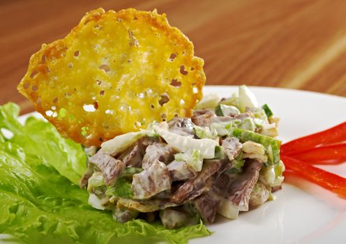 Tasty salad of beef tongue with vegetable