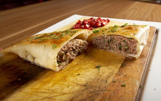 Qutab- baked Chebureki traditional  georgian meat pastry.meat in a pitta bread